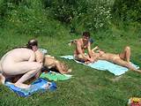 Man op het strand likken kutje Nudists Swingers